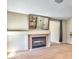 Living room featuring fireplace and large wall mirror at 7751 Locke Haven Dr, Las Vegas, NV 89123