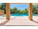 Beautiful outdoor pool area with lush landscaping, perfect for relaxation and entertainment at 7751 Locke Haven Dr, Las Vegas, NV 89123