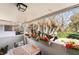 Inviting balcony area with a wooden table, cushioned chairs, and charming red flower boxes at 778 Oakmont Ave # 312, Las Vegas, NV 89109