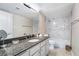 Stylish bathroom with marble backsplash, white vanity with granite countertop, and modern fixtures at 778 Oakmont Ave # 312, Las Vegas, NV 89109