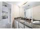Bathroom boasts granite countertops, a marble backsplash, neutral paint, and modern fixtures at 778 Oakmont Ave # 312, Las Vegas, NV 89109