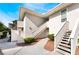 Modern condo exterior shows a stairway and entrance, complemented by small, well-maintained landscaping at 778 Oakmont Ave # 312, Las Vegas, NV 89109