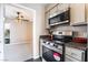 Well-equipped kitchen with stainless steel appliances, granite counters, and an open view to the living area at 778 Oakmont Ave # 312, Las Vegas, NV 89109