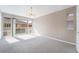 Bright living room with carpet flooring, natural light and a sliding glass door to the balcony at 778 Oakmont Ave # 312, Las Vegas, NV 89109