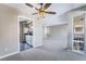 Bright living area with neutral colors, carpet, updated ceiling fan and access to the patio and kitchen at 778 Oakmont Ave # 312, Las Vegas, NV 89109