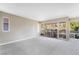Spacious living room with new carpet and sliding glass doors leading to the balcony at 778 Oakmont Ave # 312, Las Vegas, NV 89109