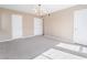 Large living room with neutral carpeting, two entrances, and plenty of space to make your own at 778 Oakmont Ave # 312, Las Vegas, NV 89109