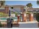 Community pool area with well-maintained landscaping and a grill, perfect for outdoor gatherings at 778 Oakmont Ave # 312, Las Vegas, NV 89109