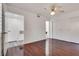 Bedroom with wood-look floors, ceiling fan, white walls and a closet with sliding doors at 7950 W Flamingo Rd # 2065, Las Vegas, NV 89147