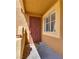 Inviting front door to home featuring security gate, covered entrance, and welcome mat at 7950 W Flamingo Rd # 2065, Las Vegas, NV 89147