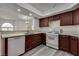 Bright open concept kitchen featuring granite countertops, an oven and stainless steel dishwasher at 7950 W Flamingo Rd # 2065, Las Vegas, NV 89147