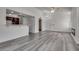 Open living space featuring modern floors and views to the kitchen area at 7950 W Flamingo Rd # 2065, Las Vegas, NV 89147