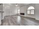 Bright living room with modern fireplace, vaulted ceiling, and stylish gray flooring at 7950 W Flamingo Rd # 2065, Las Vegas, NV 89147