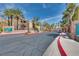 Rain Tree West community street view showcasing well-maintained buildings and lush landscaping at 7950 W Flamingo Rd # 2065, Las Vegas, NV 89147