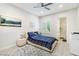 Comfortable bedroom with a plaid comforter, soft rug, and ensuite bathroom access for a relaxing, private retreat at 801 Aquitaine Ct, Las Vegas, NV 89145