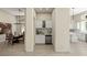 Convenient butler's pantry with built-in wine storage, a sink, and seamless transition to dining area at 801 Aquitaine Ct, Las Vegas, NV 89145
