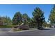 Queensridge community entrance featuring a decorative sign, manicured landscaping, and guard house at 801 Aquitaine Ct, Las Vegas, NV 89145