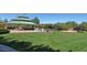 Community park featuring a covered picnic area, well-maintained lawn, and playground at 801 Aquitaine Ct, Las Vegas, NV 89145