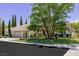 Expansive front yard and lush trees on this property located on a quiet street at 801 Aquitaine Ct, Las Vegas, NV 89145