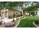 Charming single-story home featuring a lush, well-manicured front yard and inviting curb appeal at 801 Aquitaine Ct, Las Vegas, NV 89145