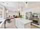 Modern kitchen boasts stainless steel appliances, white cabinetry, and a center island with pendant lighting at 801 Aquitaine Ct, Las Vegas, NV 89145