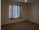 Bright bedroom with a large window, neutral carpet, and ample space for furniture at 8070 W Russell Rd # 1028, Las Vegas, NV 89113