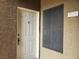 An inviting entrance featuring a bright, white door with secure lock system and well-lit surroundings at 8070 W Russell Rd # 1028, Las Vegas, NV 89113