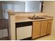 Well-organized kitchen with stainless steel sink, white dishwasher, and convenient breakfast bar at 8070 W Russell Rd # 1028, Las Vegas, NV 89113