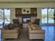 A cozy lobby with a fireplace and seating offers a relaxing spot with pool views through glass doors at 8070 W Russell Rd # 1028, Las Vegas, NV 89113
