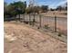 Backyard with black metal fence, landscaping and golf course view at 8721 Robinson Ridge Dr, Las Vegas, NV 89117