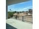 Balcony view overlooking desert landscape and mature trees, offering serene privacy at 8721 Robinson Ridge Dr, Las Vegas, NV 89117