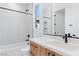 Modern bathroom showcasing white marble countertops, wood cabinets, and a glass-enclosed shower at 8721 Robinson Ridge Dr, Las Vegas, NV 89117