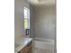 Bathroom featuring a modern vanity with quartz countertop and tiled shower at 8721 Robinson Ridge Dr, Las Vegas, NV 89117