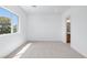 Bright, spacious bedroom with large window and an adjoining bathroom entrance at 8721 Robinson Ridge Dr, Las Vegas, NV 89117