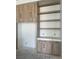 A modern, built-in cabinet set with open shelving sits in the kitchen area at 8721 Robinson Ridge Dr, Las Vegas, NV 89117