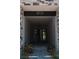 Covered entryway with a modern front door and exterior stone accents at 8721 Robinson Ridge Dr, Las Vegas, NV 89117