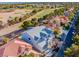 New construction home with a gray roof, surrounded by lush landscaping and a golf course in the neighborhood at 8721 Robinson Ridge Dr, Las Vegas, NV 89117