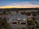 Two-story home with stone accents, three-car garage, desert landscaping, and golf course views at 8721 Robinson Ridge Dr, Las Vegas, NV 89117