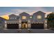 Two-story home with stone accents, three-car garage, desert landscaping, and lots of curb appeal at 8721 Robinson Ridge Dr, Las Vegas, NV 89117