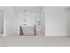 Bright upstairs hallway featuring decorative light fixture and carpeted floors at 8721 Robinson Ridge Dr, Las Vegas, NV 89117