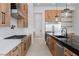 Stylish kitchen with stainless steel appliances, island, and wood cabinetry at 8721 Robinson Ridge Dr, Las Vegas, NV 89117