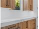 Bright kitchen features wood cabinets and light countertops near a window at 8721 Robinson Ridge Dr, Las Vegas, NV 89117