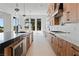 Modern kitchen with island, stainless appliances, and seamless flow to living area at 8721 Robinson Ridge Dr, Las Vegas, NV 89117