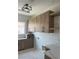 Bright laundry room featuring custom cabinets, counter space, and modern hardware at 8721 Robinson Ridge Dr, Las Vegas, NV 89117