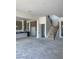 Open floor plan featuring a modern kitchen and staircase at 8721 Robinson Ridge Dr, Las Vegas, NV 89117