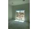 Bright living room featuring sliding glass doors offering scenic outdoor views at 8721 Robinson Ridge Dr, Las Vegas, NV 89117