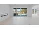 Bright living room with sliding glass doors, fireplace, and backyard views at 8721 Robinson Ridge Dr, Las Vegas, NV 89117