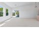 Spacious living room with large windows and sliding glass door for outdoor living on a covered patio at 8721 Robinson Ridge Dr, Las Vegas, NV 89117