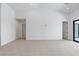Spacious living room featuring high ceilings and access to an outdoor balcony at 8721 Robinson Ridge Dr, Las Vegas, NV 89117
