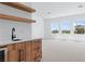 Large living room features custom shelves and large windows offering abundant natural light at 8721 Robinson Ridge Dr, Las Vegas, NV 89117